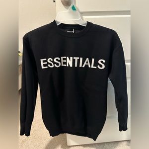 Essential sweater fits small to semi-large looks still new
